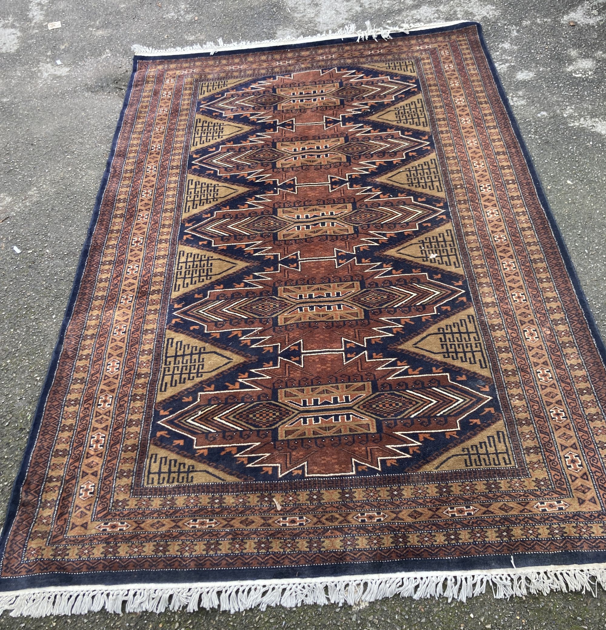 A Caucasian brown ground carpet, 280 x 190cm